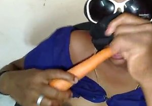 Exotic lady sucks on a carrot and fucks herself too