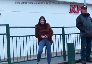 Cute brunette in tight jeans shows her awesome curves